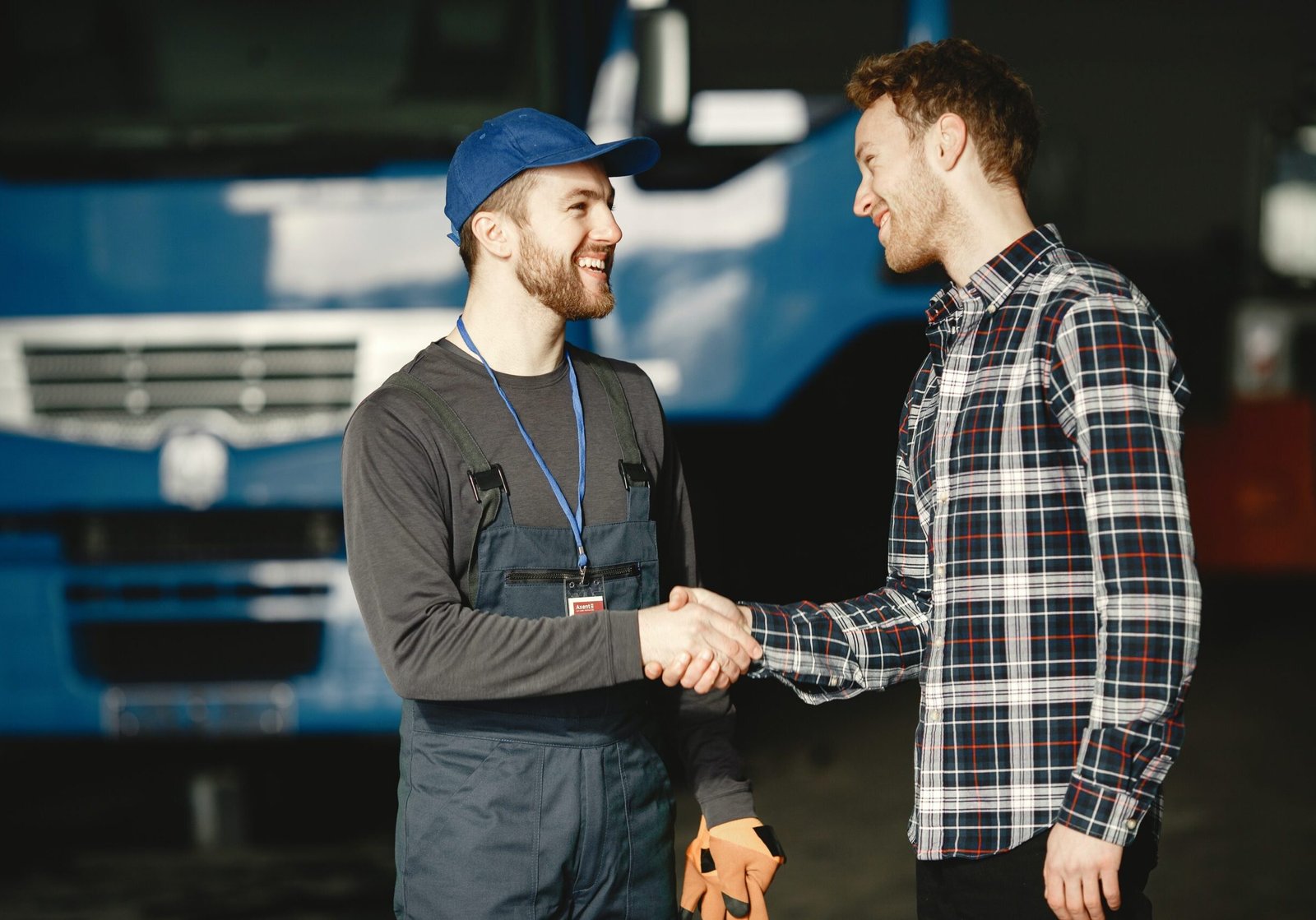 mechanic-handshake Mechanic and client handshake at an autoshop